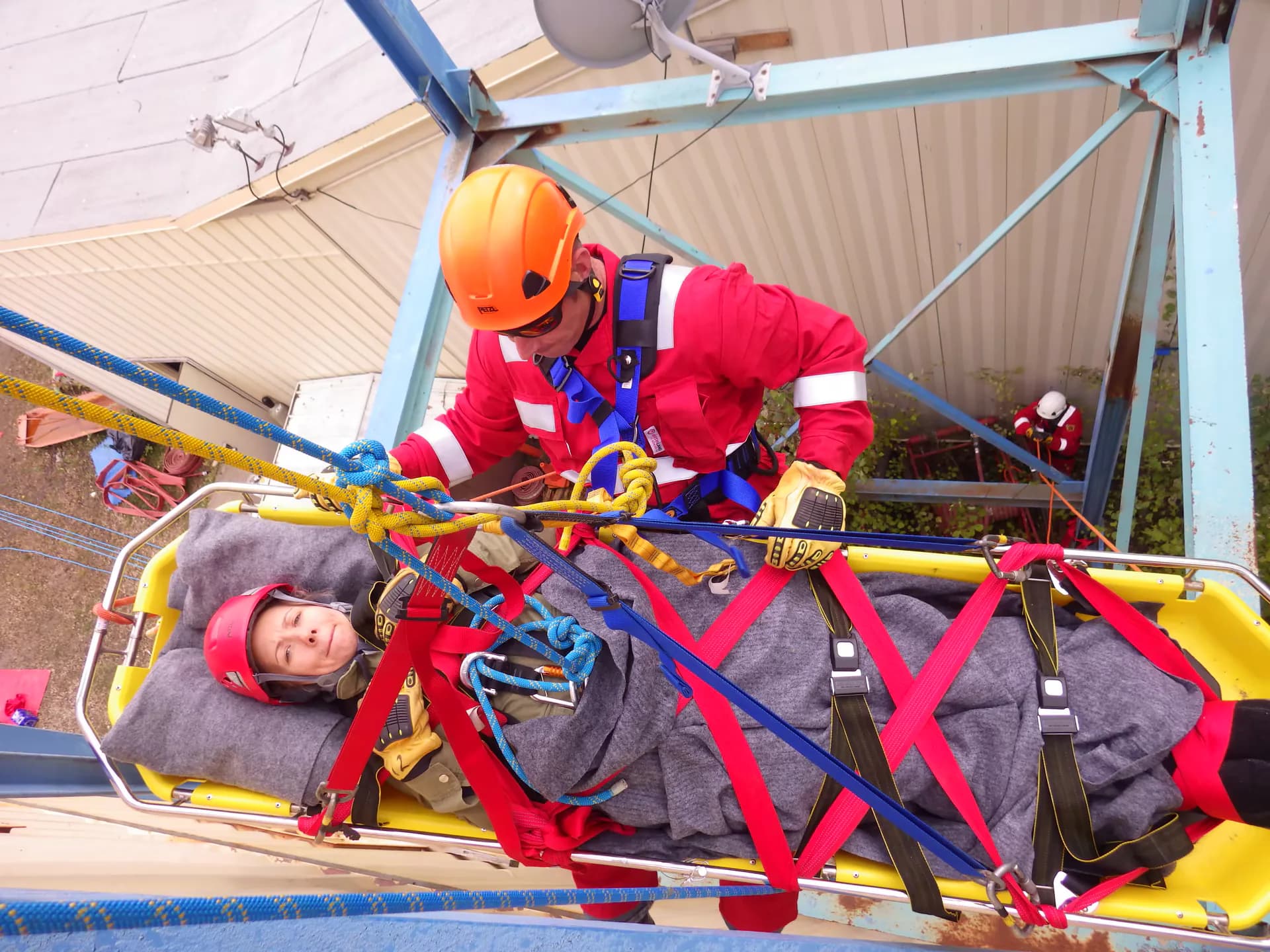Rescue technicians conducting a high-angle patient recovery exercise